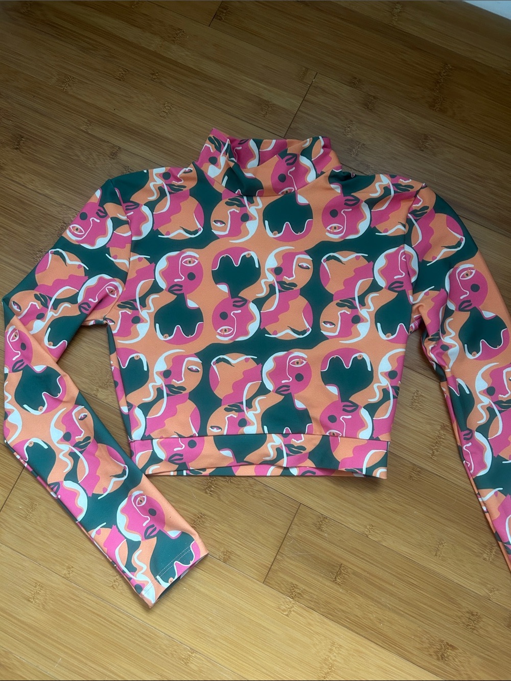 Dazey LA Pink Orange Green Abstract Face Print Cropped Long Sleeve Top